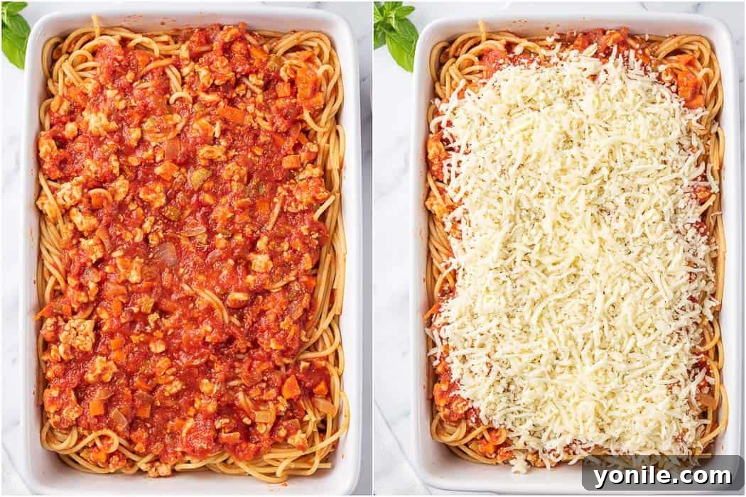 Simple Baked Spaghetti Casserole 6 Spaghetti transferred to a baking dish, generously topped with reserved sauce and mozzarella cheese before baking.