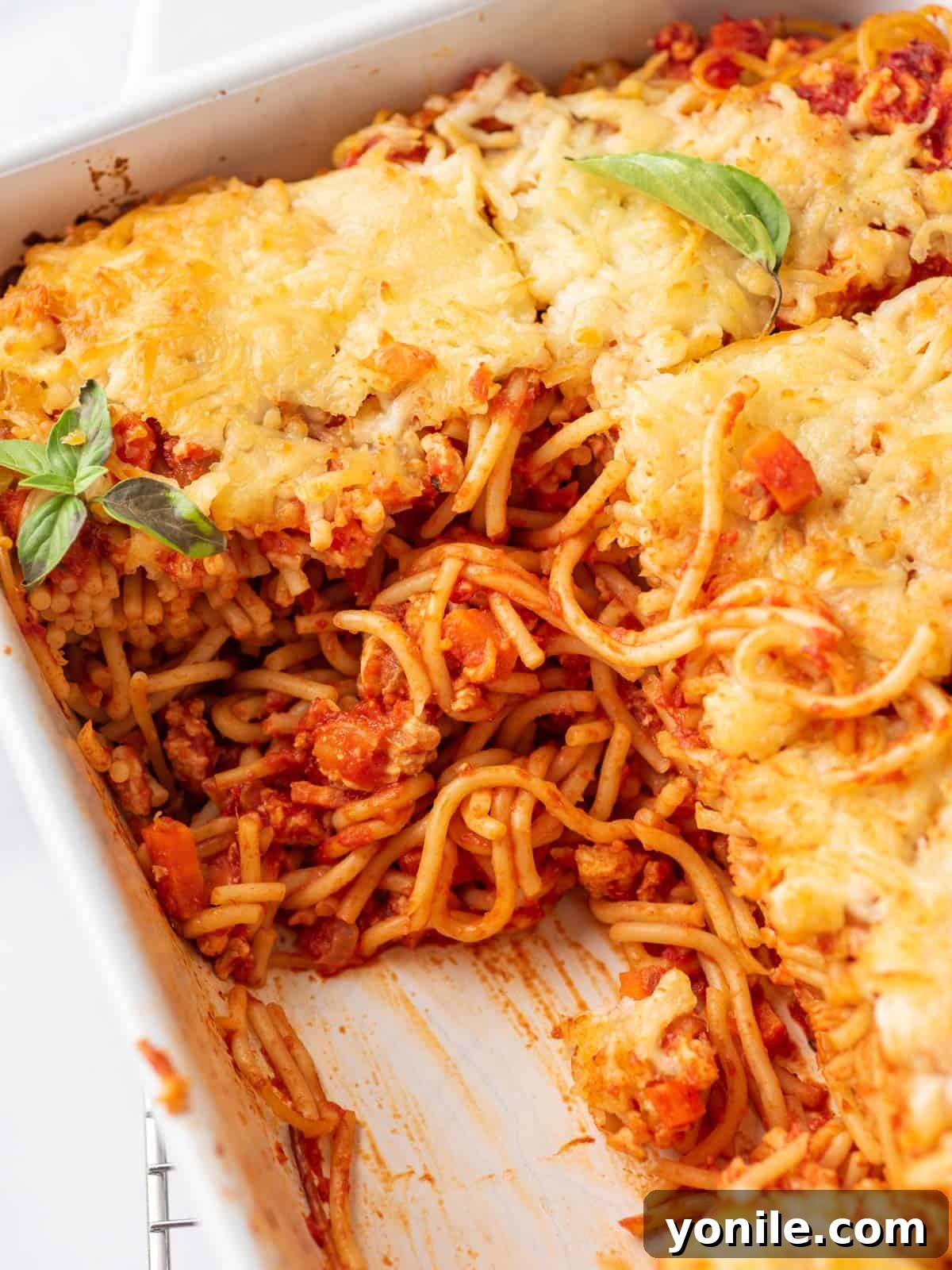 Simple Baked Spaghetti Casserole 8 A large dish of Easy Spaghetti Bake, presented beautifully in the center of the frame, ready for serving.