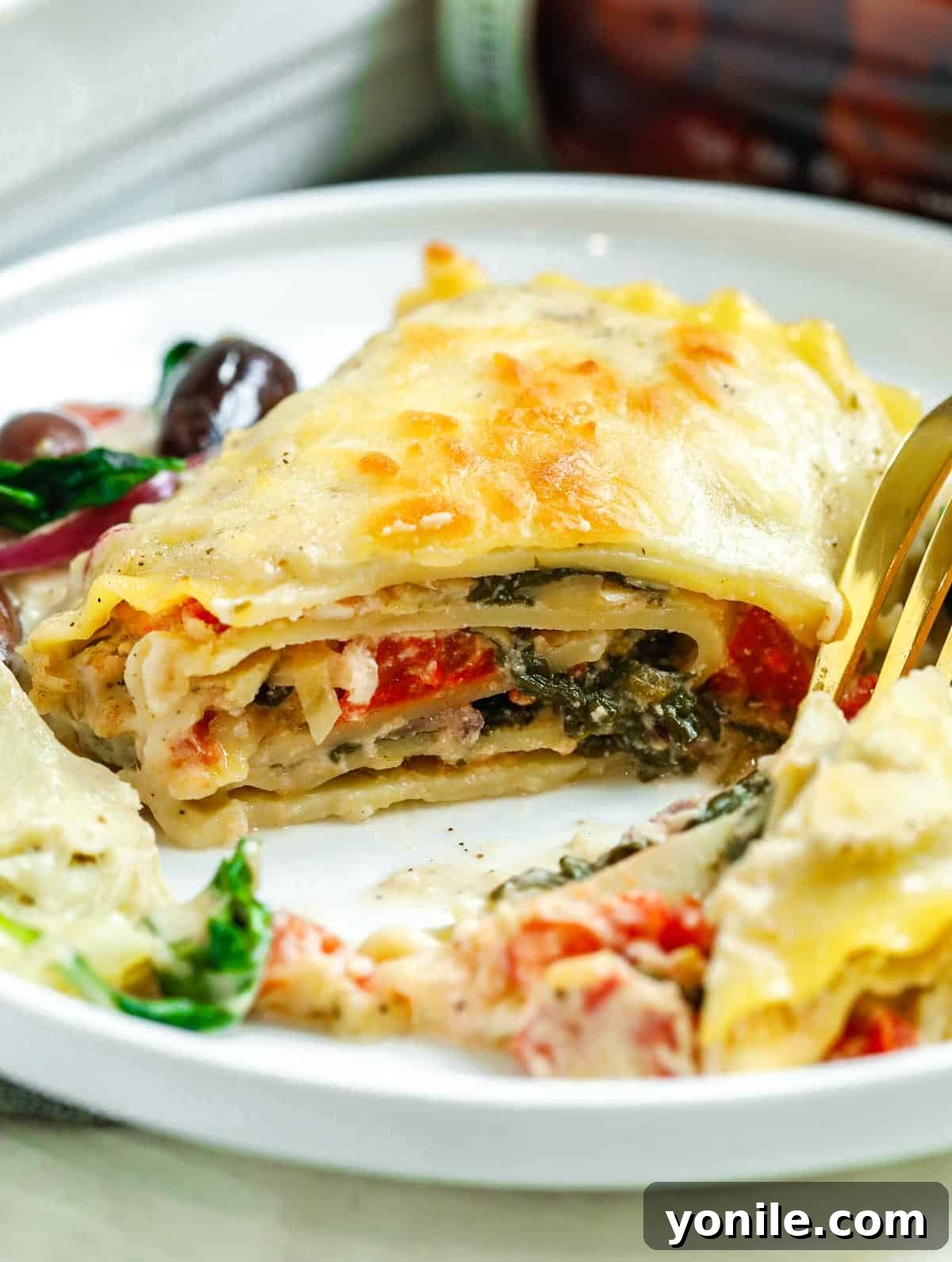 Greek White Alfredo Lasagna cut to show the center