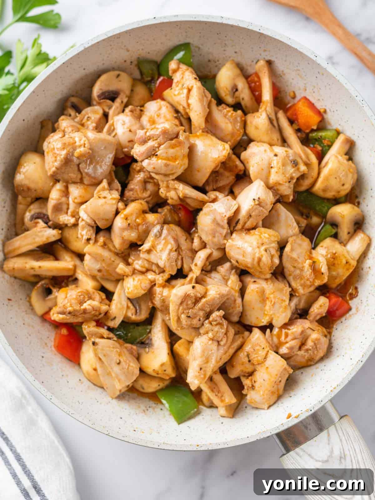 Sizzling Garlic Butter Mushroom Chicken Bites 6 Cooked chicken bites mixed back into the skillet with the sautéed mushrooms and bell peppers, coated in a rich sauce.