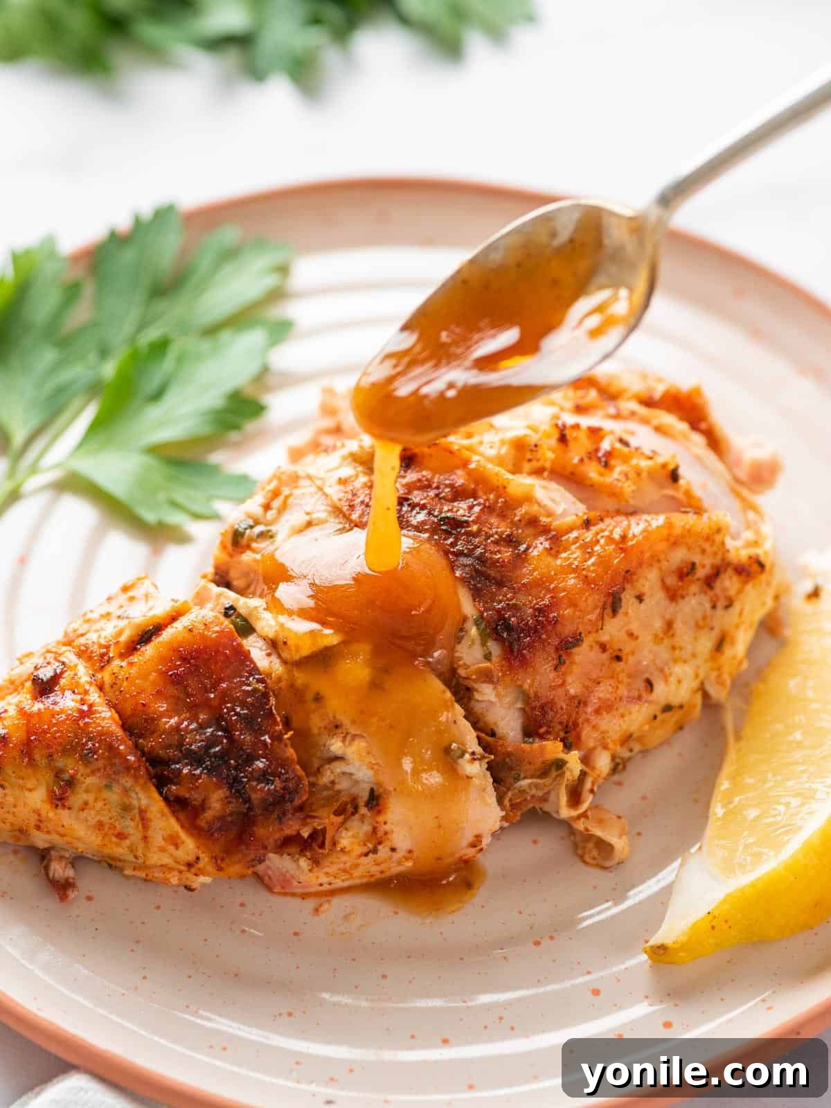 Succulent Spatchcock Roast Chicken 12 A perfectly cooked chicken breast, sliced and topped with a spoonful of rich, homemade gravy.