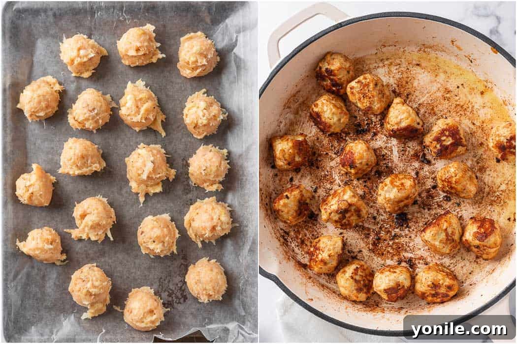 Golden-brown Swedish meatballs cooking in a skillet on a stovetop, showing their even browning.