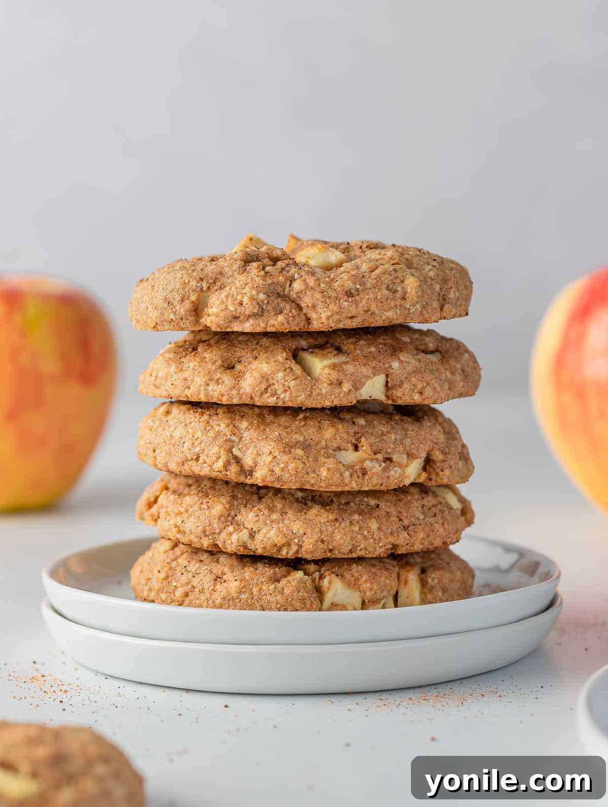 A stack of healthy apple pie oatmeal cookies, perfectly golden brown and inviting.