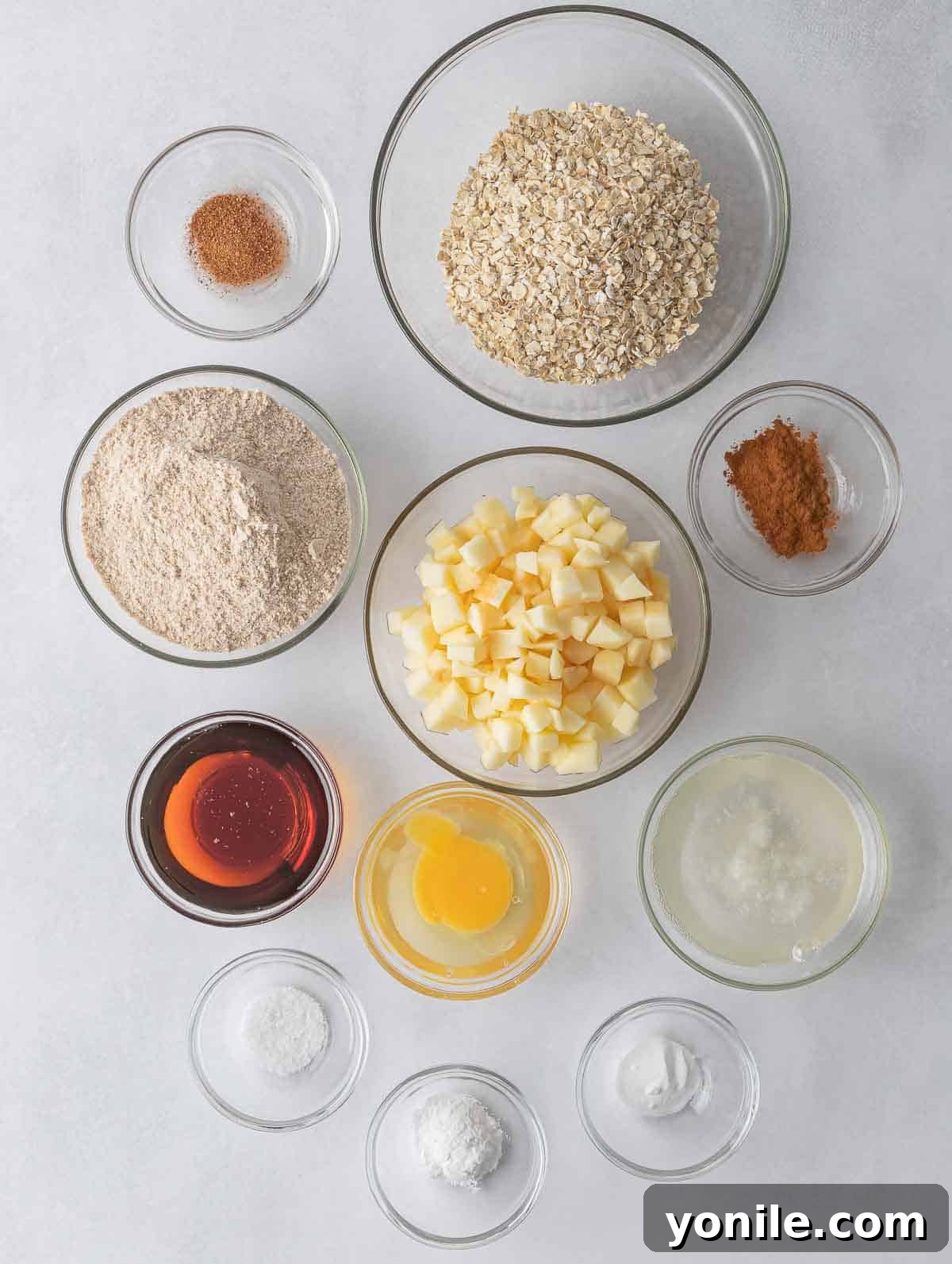 Ingredients laid out on a kitchen counter, ready to make healthy apple pie oatmeal cookies.