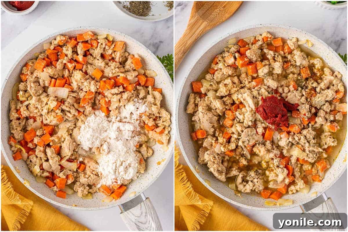 The thickened chicken and vegetable filling for shepherds pie, glistening in a skillet