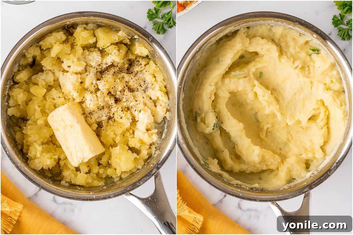 A close-up of potatoes being mashed with butter and cream in a pot, creating a smooth texture