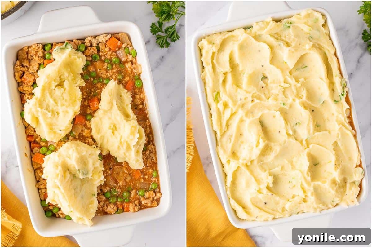 Shepherds pie assembled in a rectangular baking dish, with creamy mashed potatoes covering the chicken filling