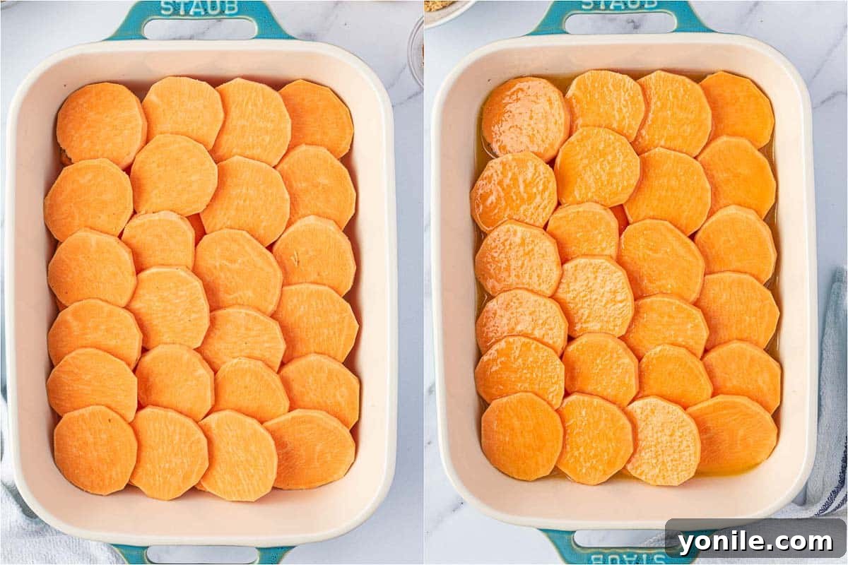 Sliced sweet potatoes arranged in a baking dish, coated with the butter and maple syrup mixture before baking