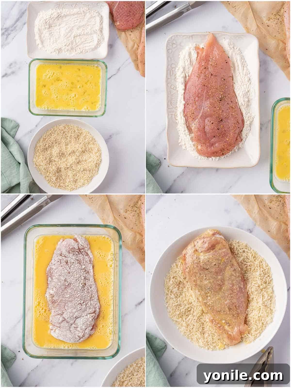 A hand coating a chicken breast in flour, egg, and breadcrumbs.