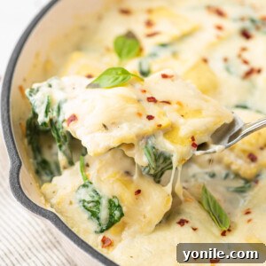 Cheese and Spinach Ravioli Recipe with a scoop being served.