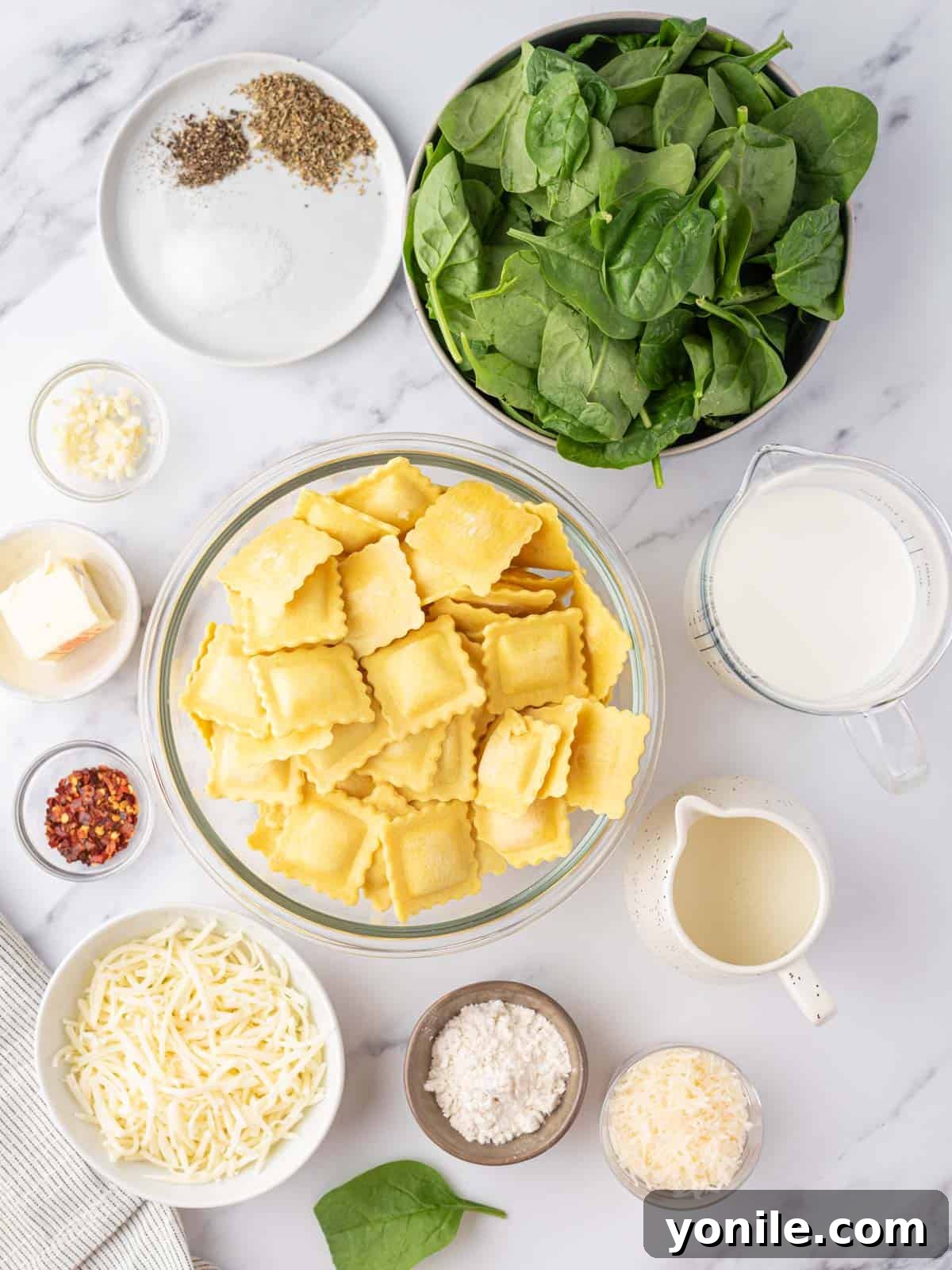 Luscious Spinach and Cheese Ravioli 3 Ingredients laid out for a Creamy Cheese and Spinach Ravioli Recipe.