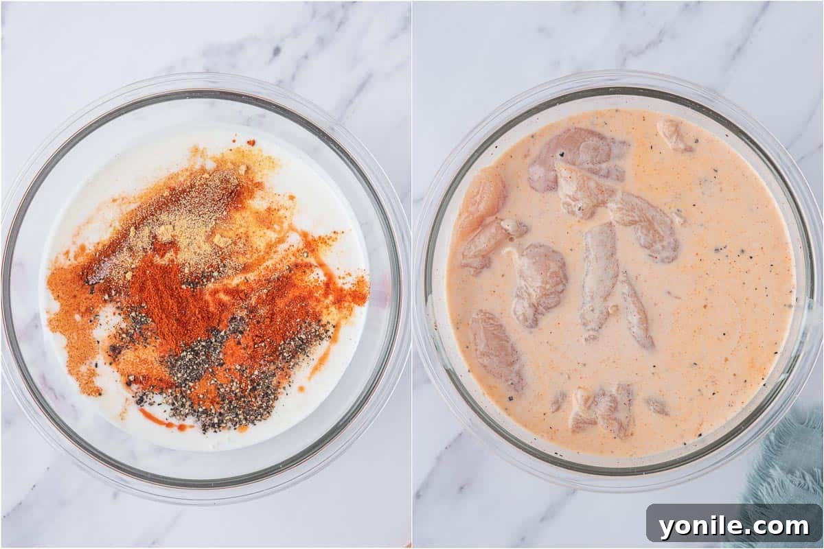 KFC's Fiery Nashville Tenders 4 Chicken tenders soaking in a buttermilk mixture in a bowl.