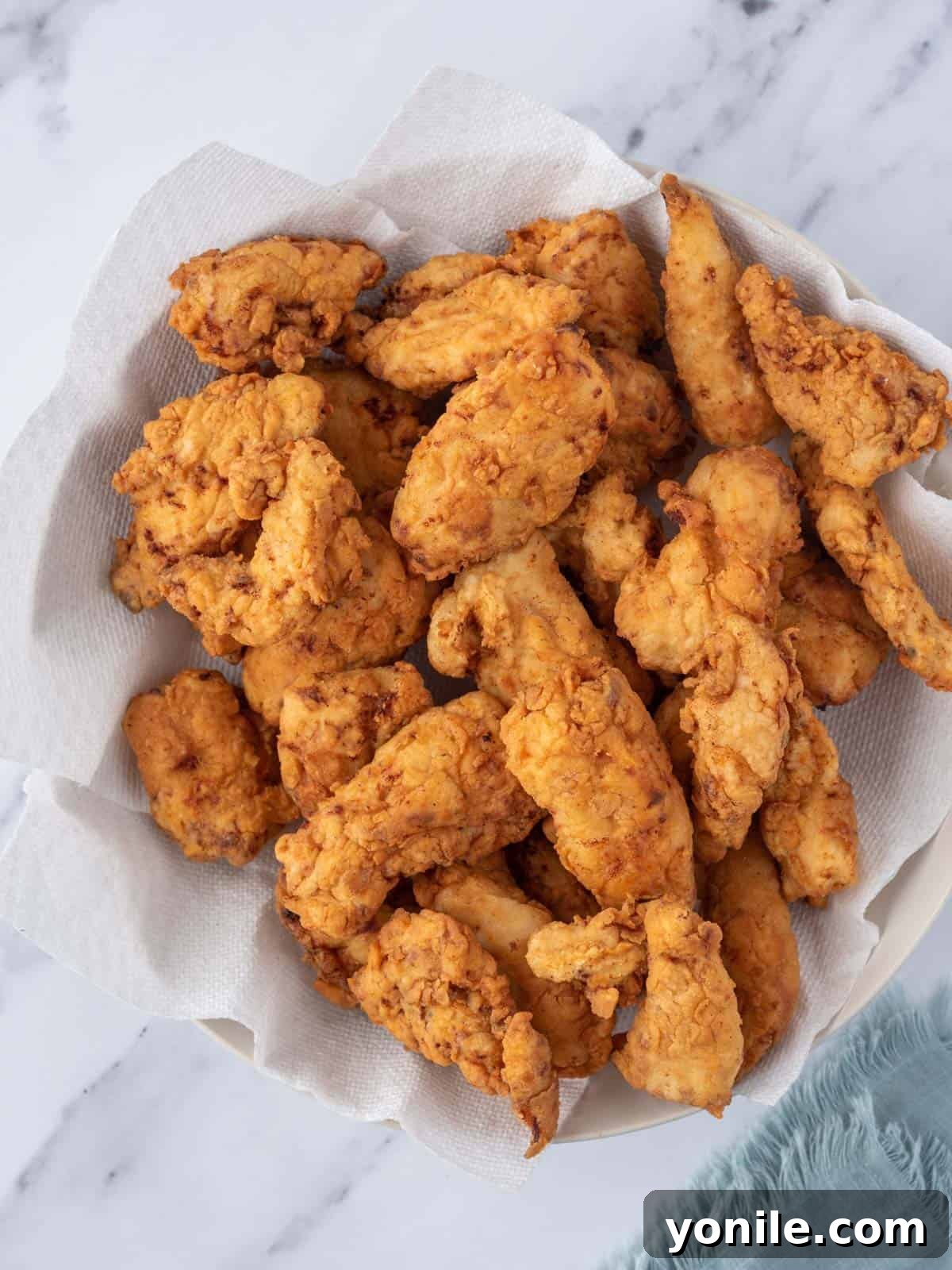 KFC's Fiery Nashville Tenders 6 A bowl filled with freshly fried chicken tenders.