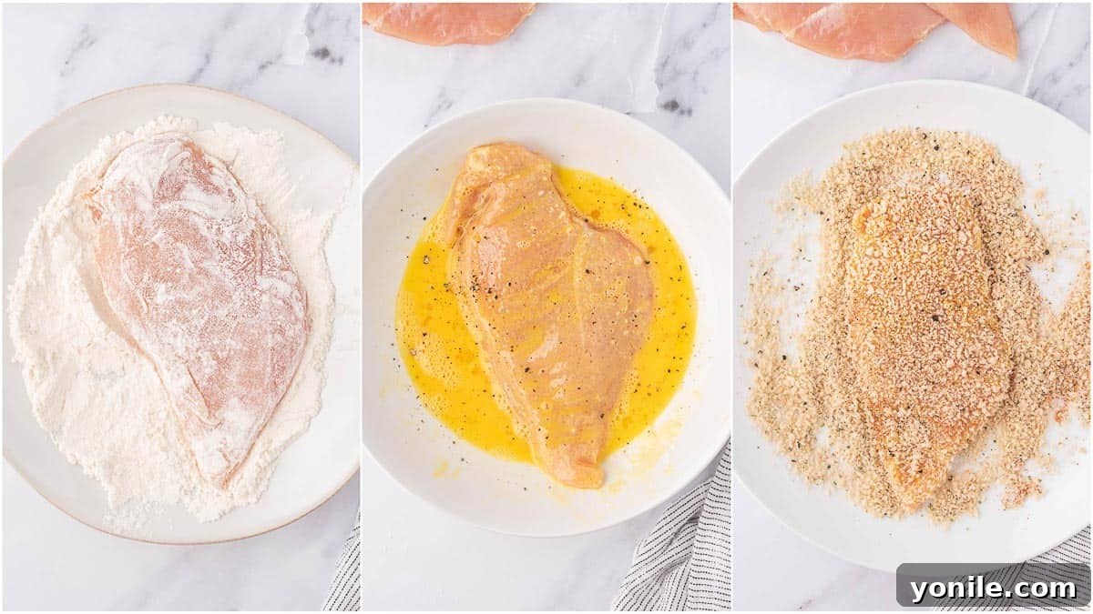 Crispy Air Fryer Chicken Cutlets 4 A three-bowl dredging station setup: one bowl for seasoned flour, one for whisked egg, and one for panko breadcrumbs, ready to coat chicken.