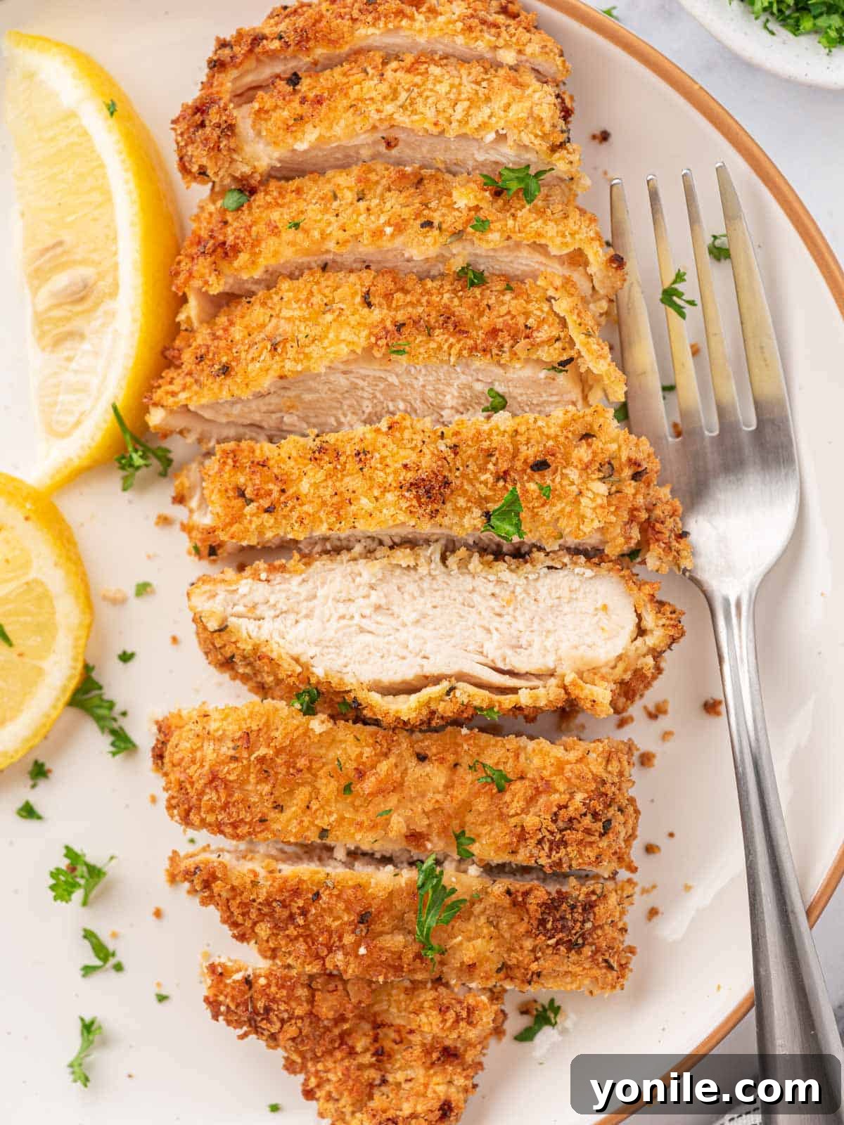 Crispy Air Fryer Chicken Cutlets 7 Multiple air fryer breaded chicken cutlets on a wire rack, showing off their perfectly crispy texture.