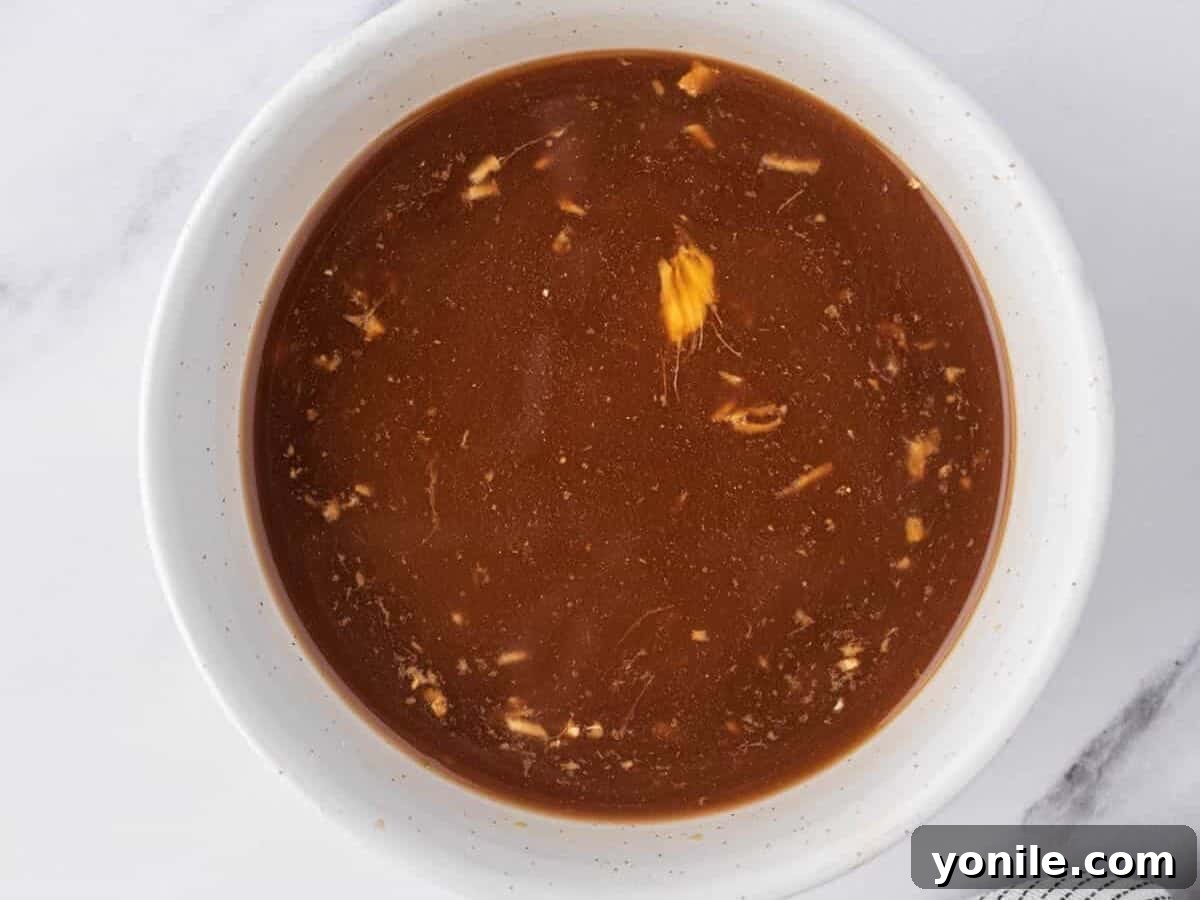 Chicken stir fry sauce is a small white dish.