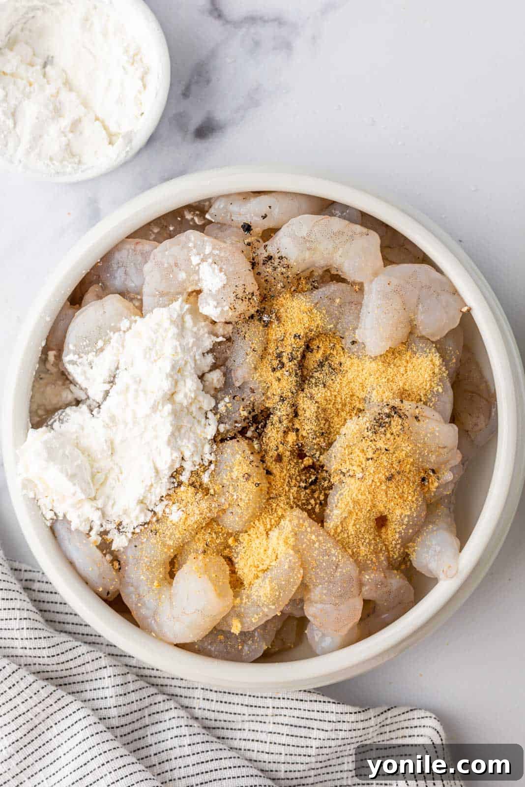 Golden Honey Walnut Shrimp 5 Coating shrimp with seasoning and cornstarch.