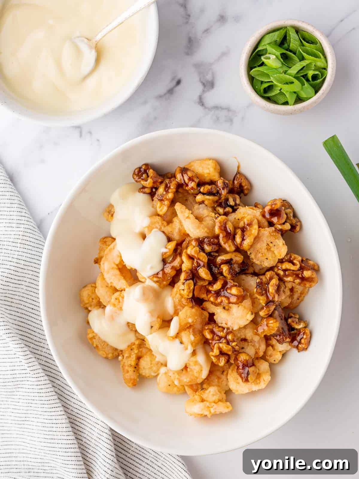 Golden Honey Walnut Shrimp 8 Combining the sauce, shrimp and walnuts for honey walnut shrimp.