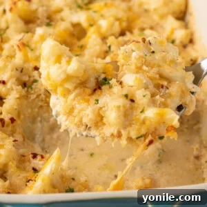 A scoop of cheese cauliflower mac and cheese.