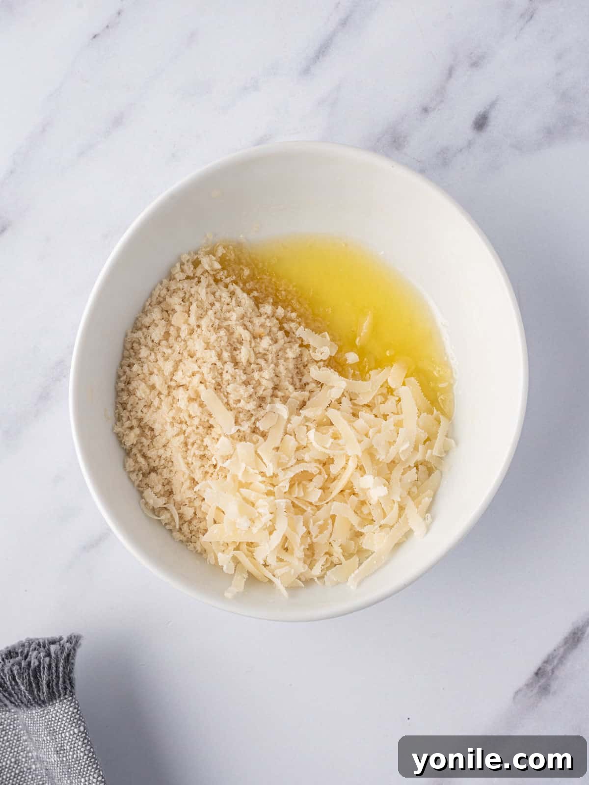 Mix of cheese bread crumbs and butter for crunchy topping.