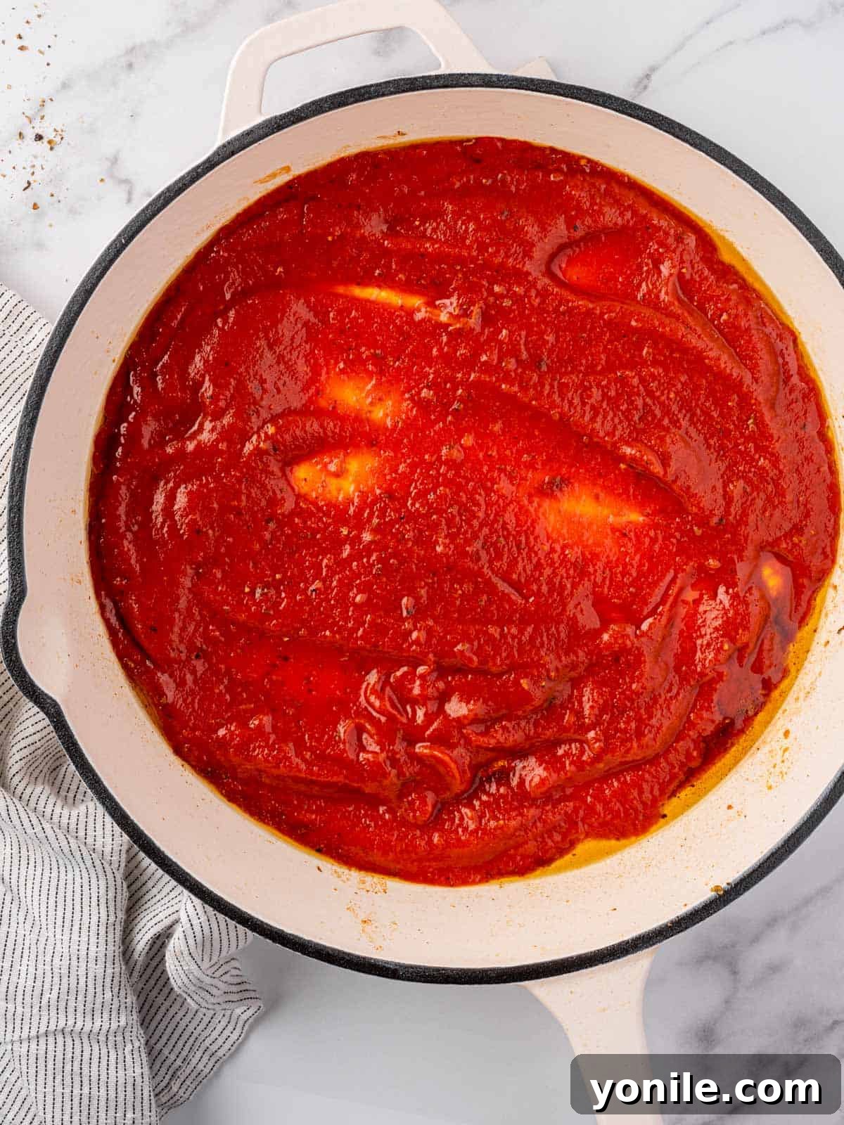 Sauce added to a pan.