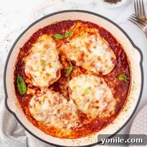 Overhead view of a pan with chicken parmesan.