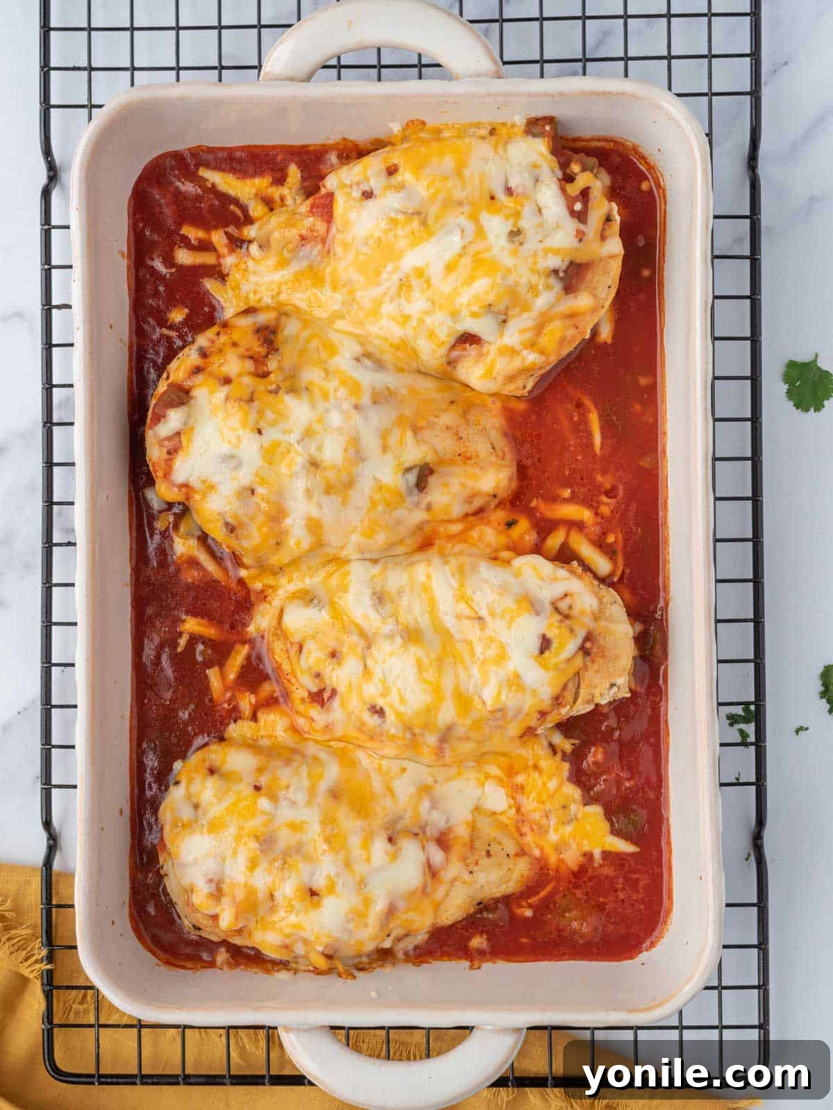 Baked salsa chicken on a wire rack.