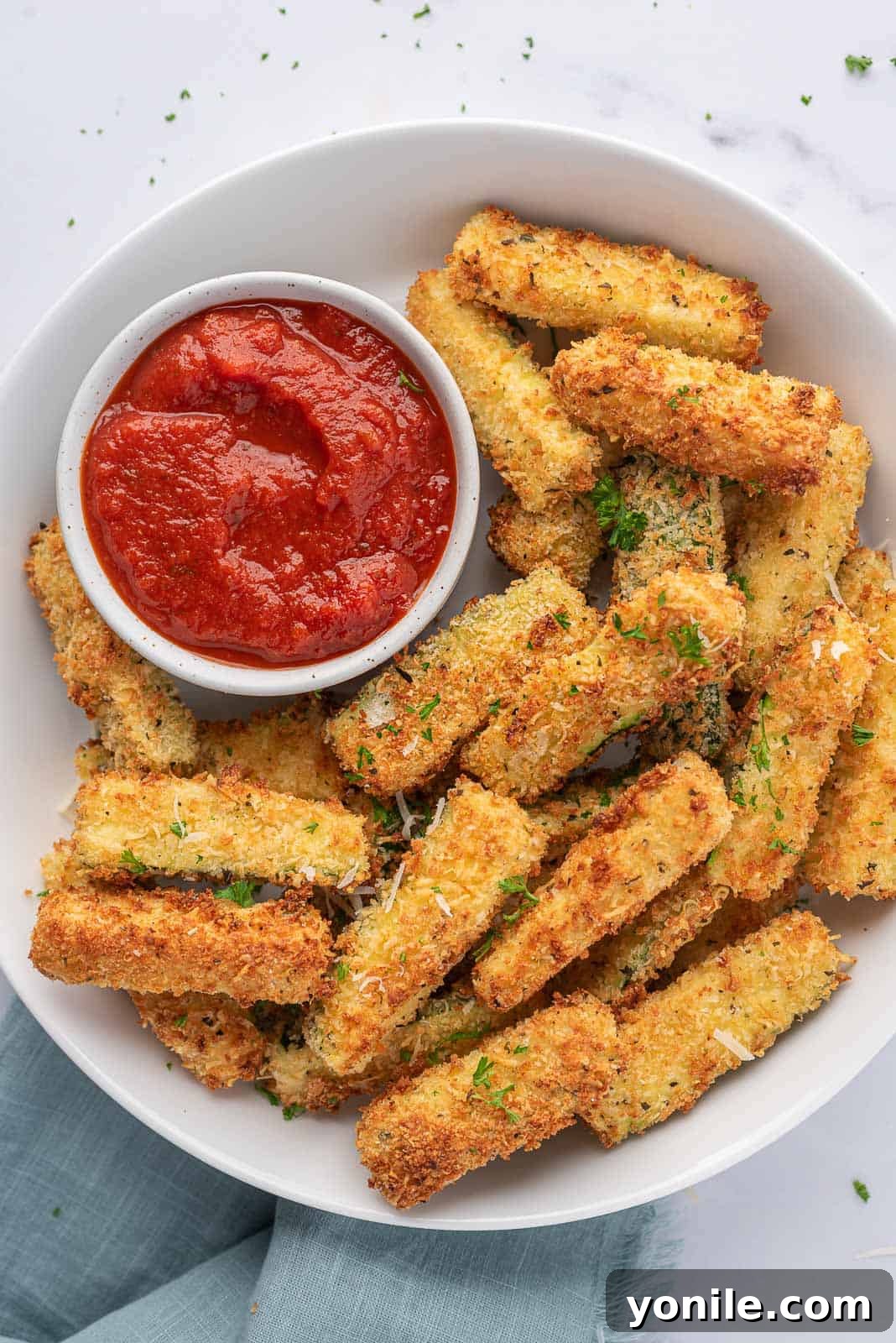 Crispy Air Fryer Zucchini Sticks 8 A platter of crispy zucchini sticks.