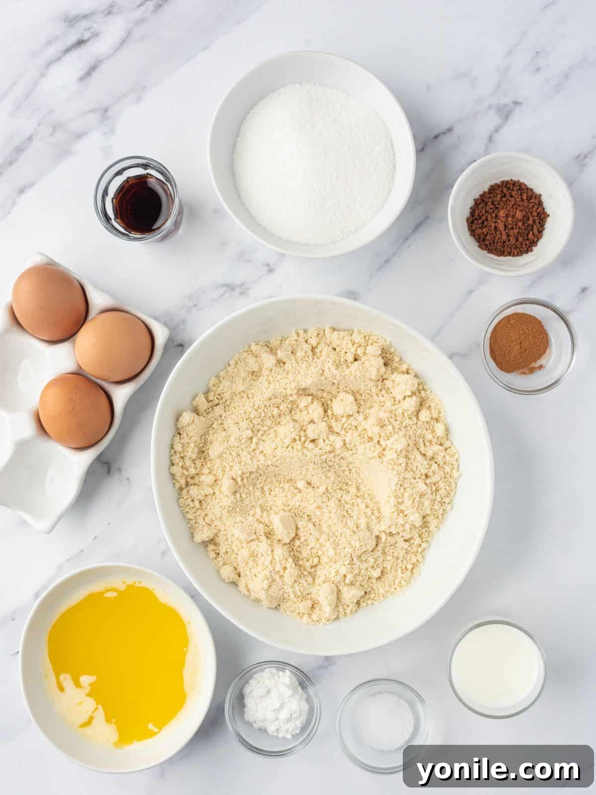 A flat lay photograph showcasing the key ingredients required to make a delectable low carb coffee cake, neatly arranged for clarity.