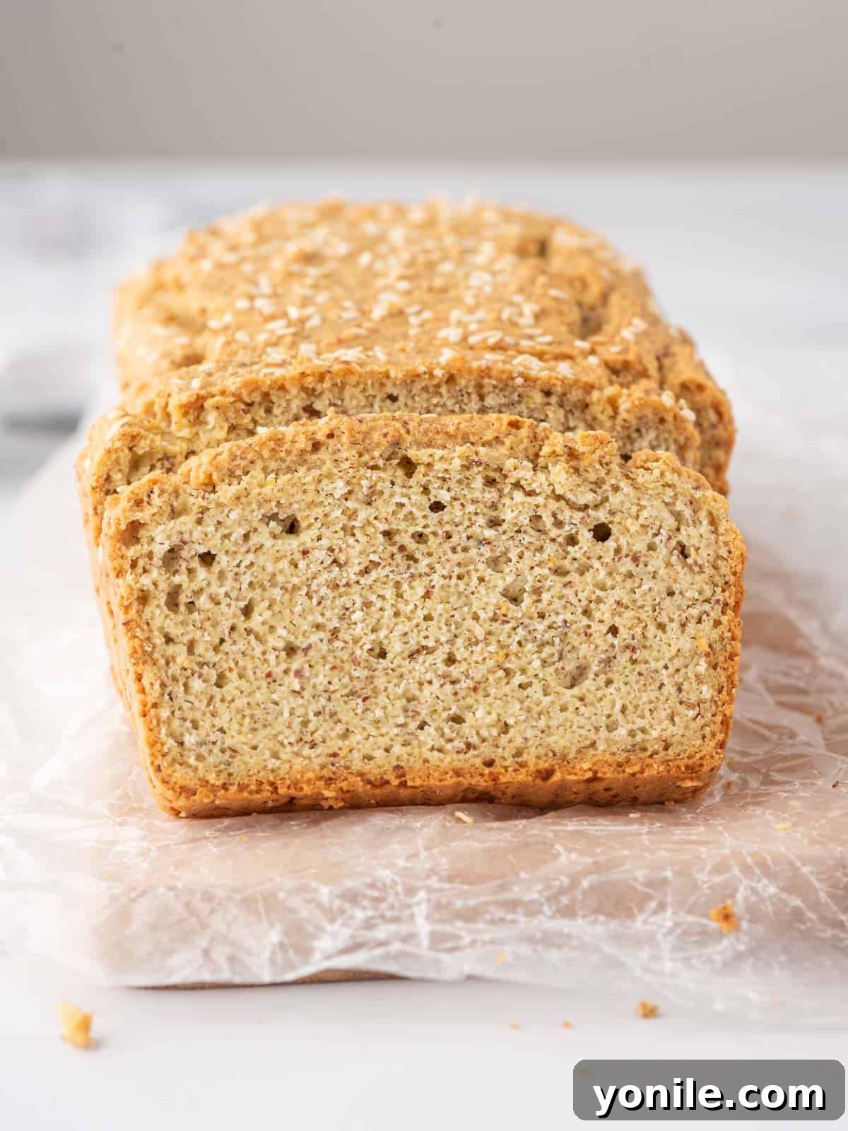 Guilt-Free Keto Sandwich Loaf 8 Close up of keto sandwich bread loaf and slice.