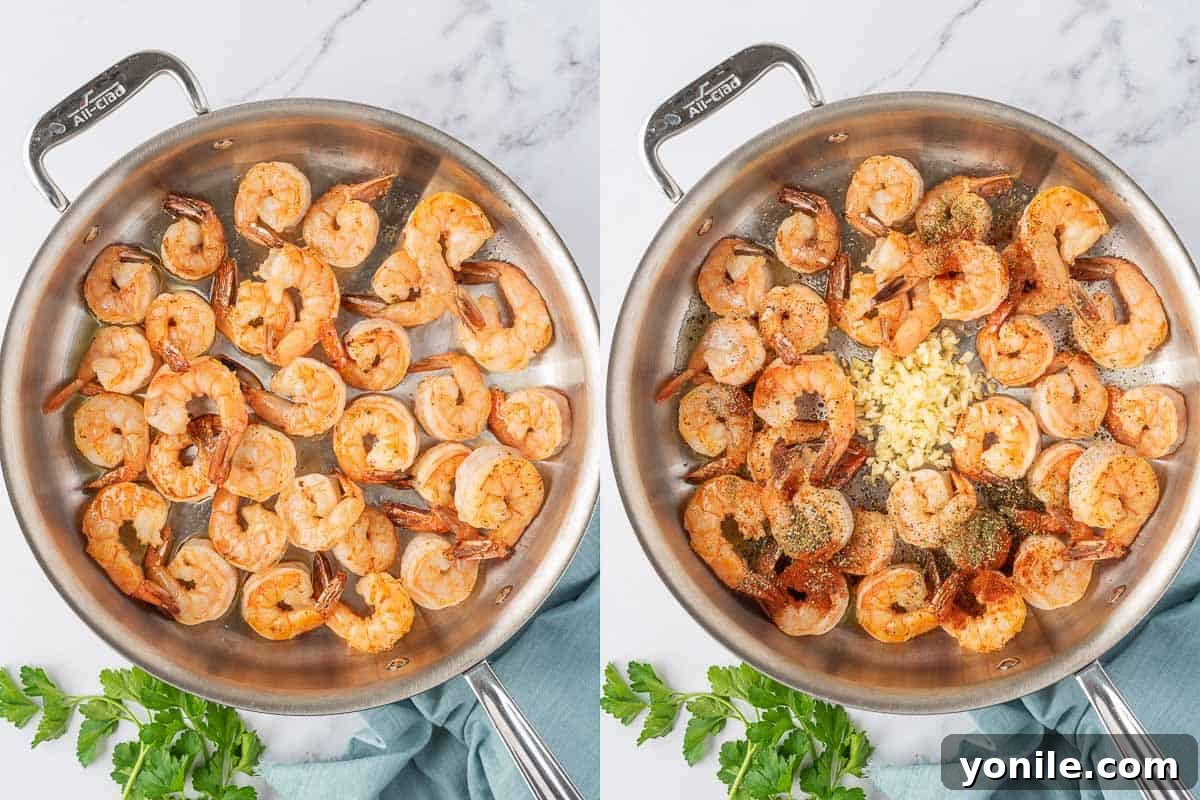 Bright and Buttery Lemon Garlic Shrimp 4 Shrimp cooking in a hot skillet, turning pink and starting to curl.