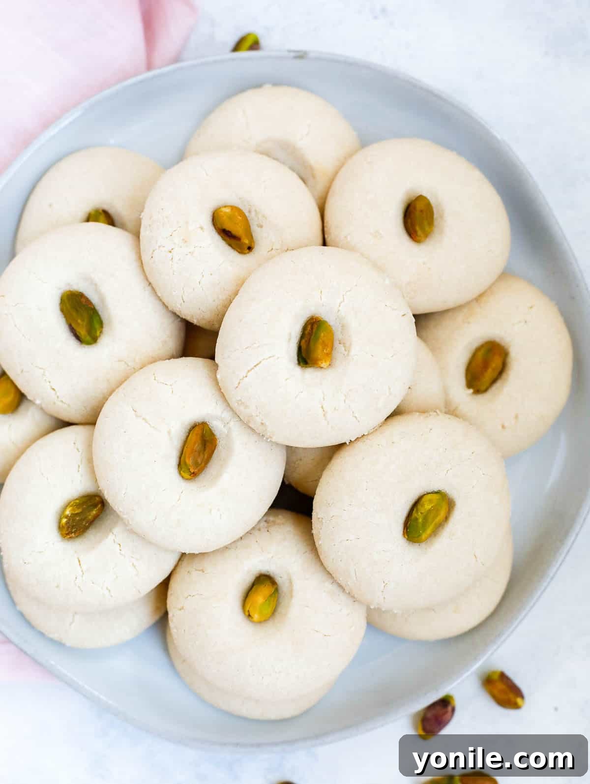 Lebanese Ghraybeh Butter Cookies 2 top down shot of the ghraybeh cookies in a white plate