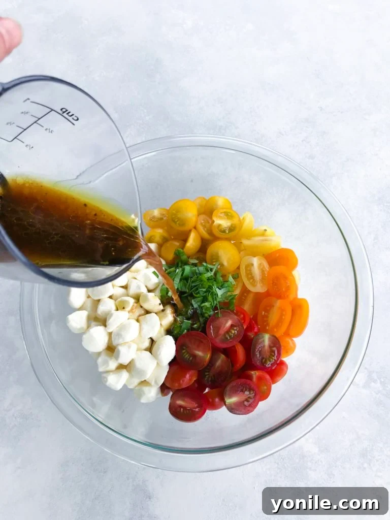Fresh Caprese with Tangy Balsamic Glaze 4 Balsamic Tomato Mozzarella Salad tossed with dressing and ready to serve