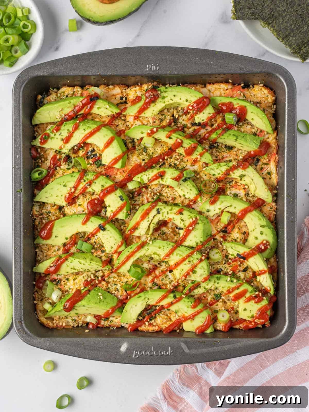 Effortless Baked Sushi 9 Sushi bake casserole in a baking pan, showing even slices.