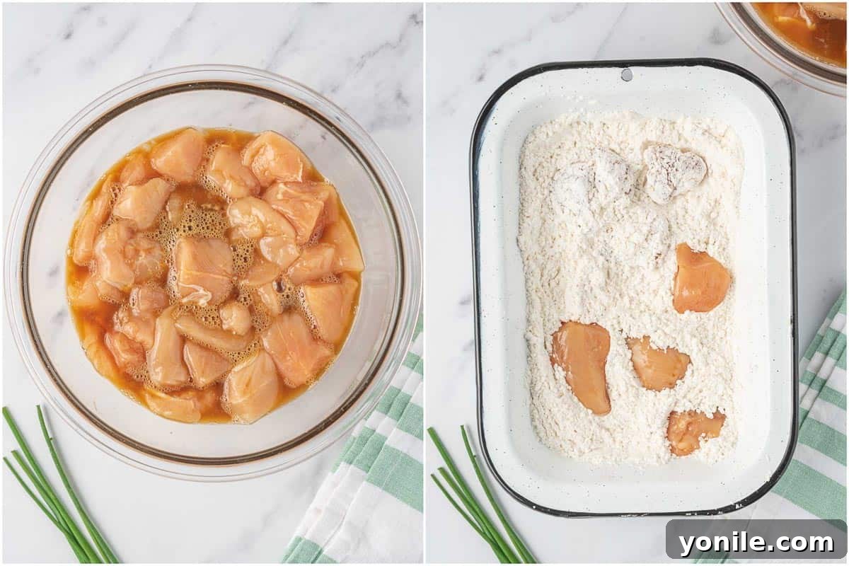 Process of dredging chicken in cornstarch and flour mixture.