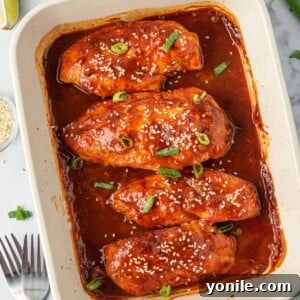 A tray of sweet and spicy honey sriracha chicken.