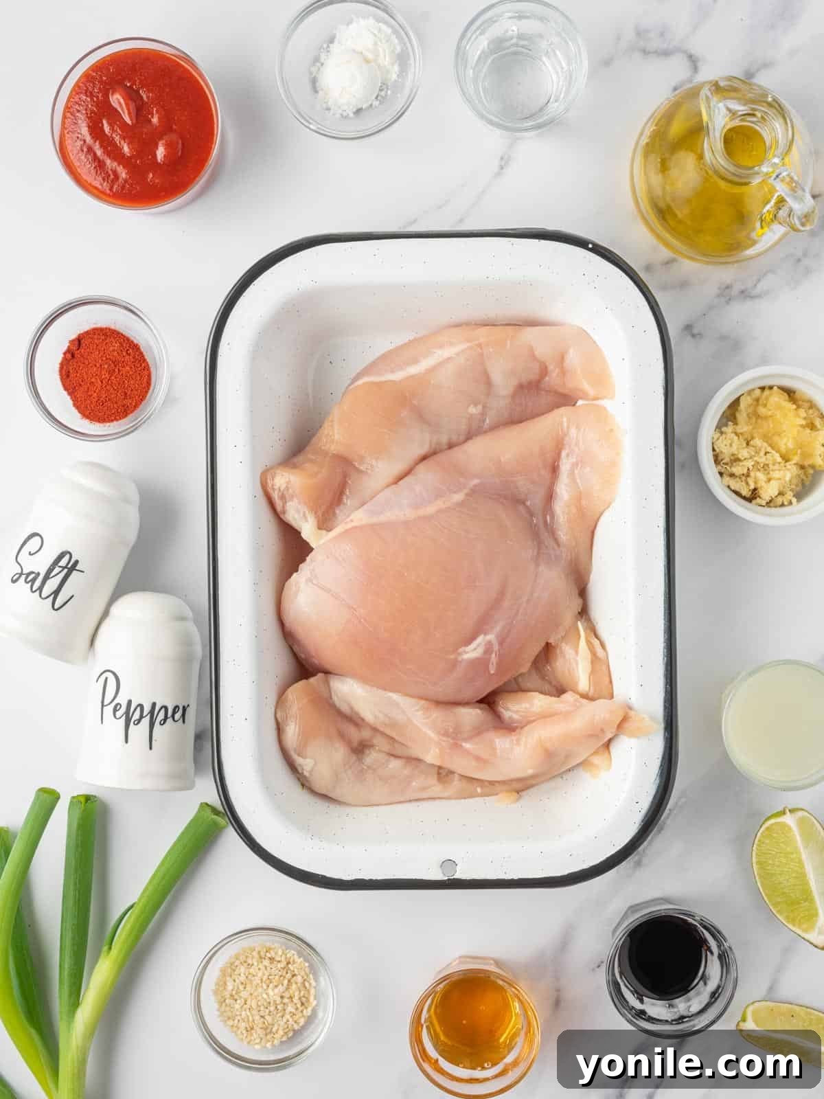 Ingredients needed for honey sriracha baked chicken breast.