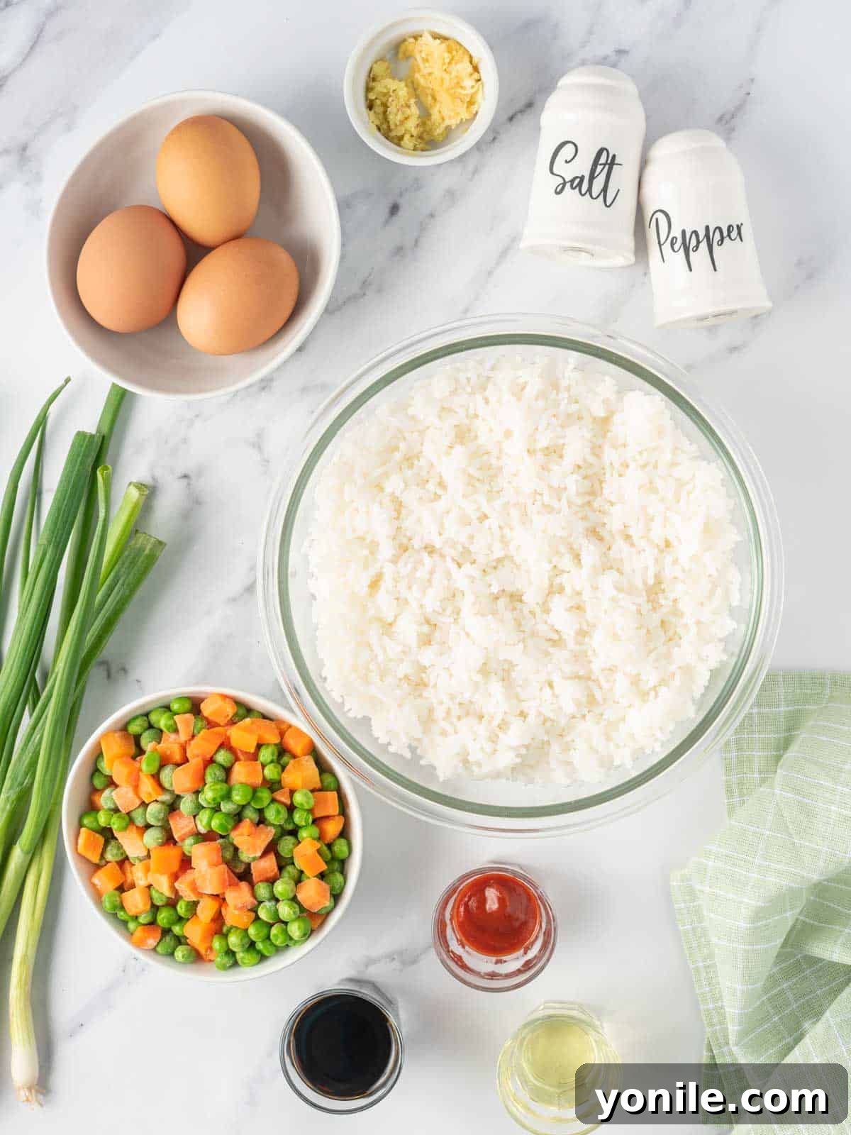 Ingredient needed for Vegetarian fried rice with egg, laid out on a table.