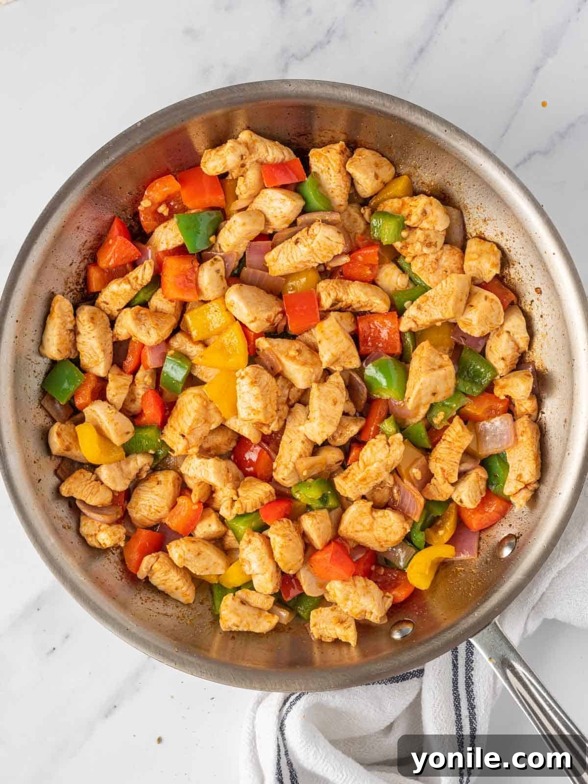 Making the easy chicken quesadillas filling.