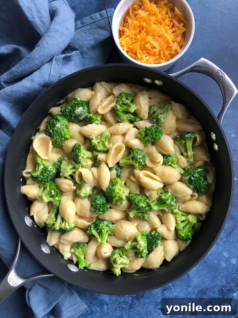 Silky Broccoli Mac 5 Close-up of the finished creamy broccoli mac and cheese in a skillet.