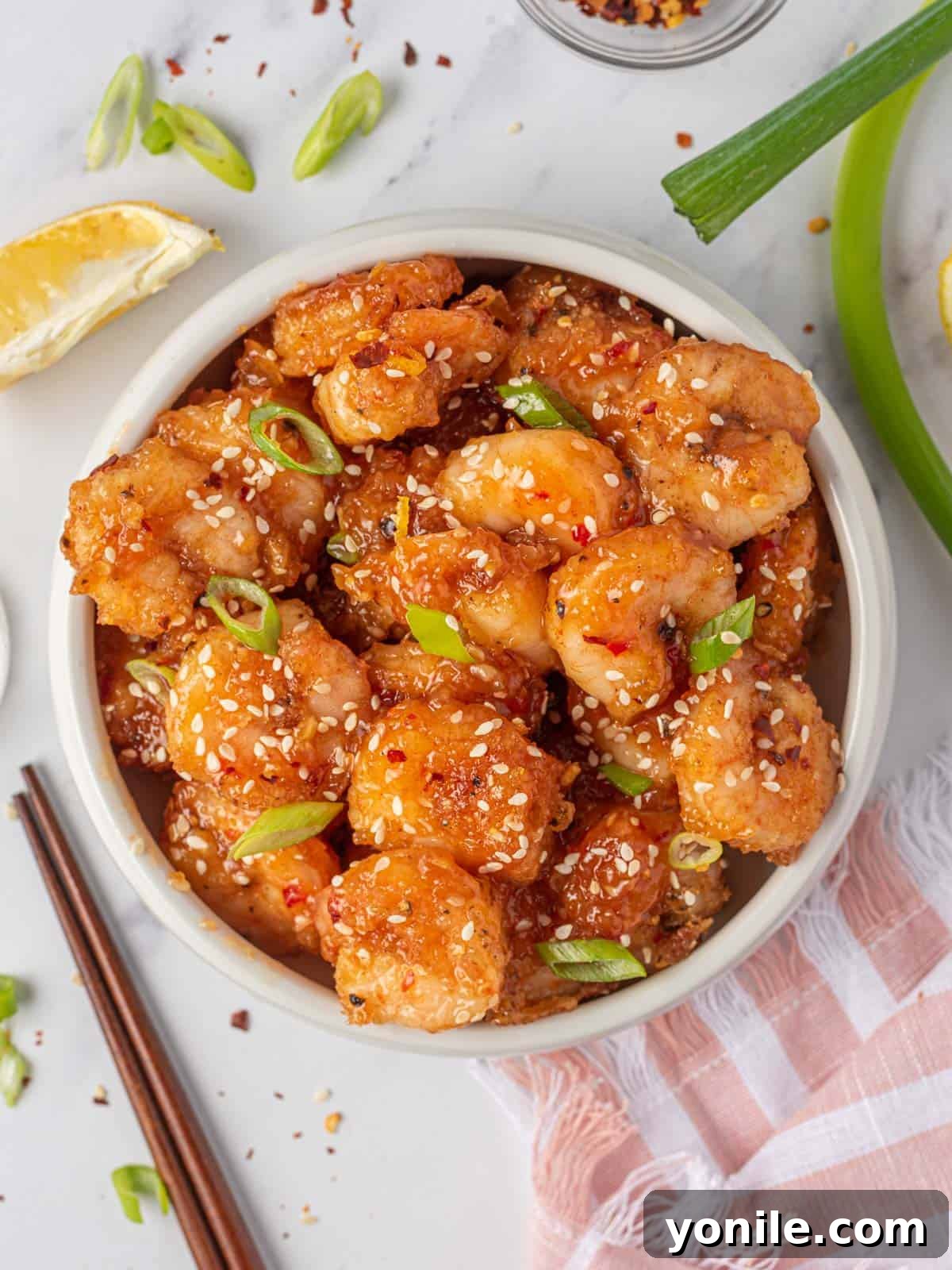 Dynamite Prawns 2 Firecracker shrimp in a serving bowl with chopsticks.