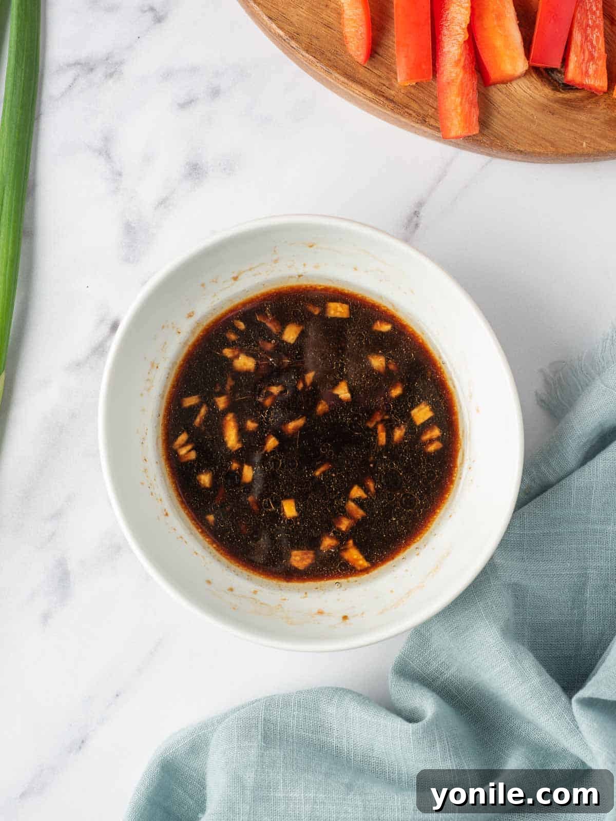 A bowl of easy lo mein sauce ready to add to veggies and noodles.