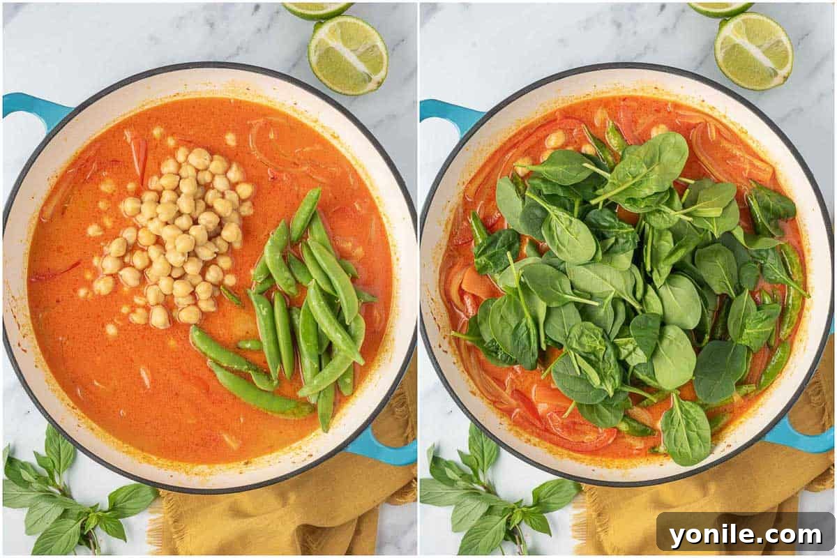 Adding chickpeas, snow peas and spinach to the red curry sauce.