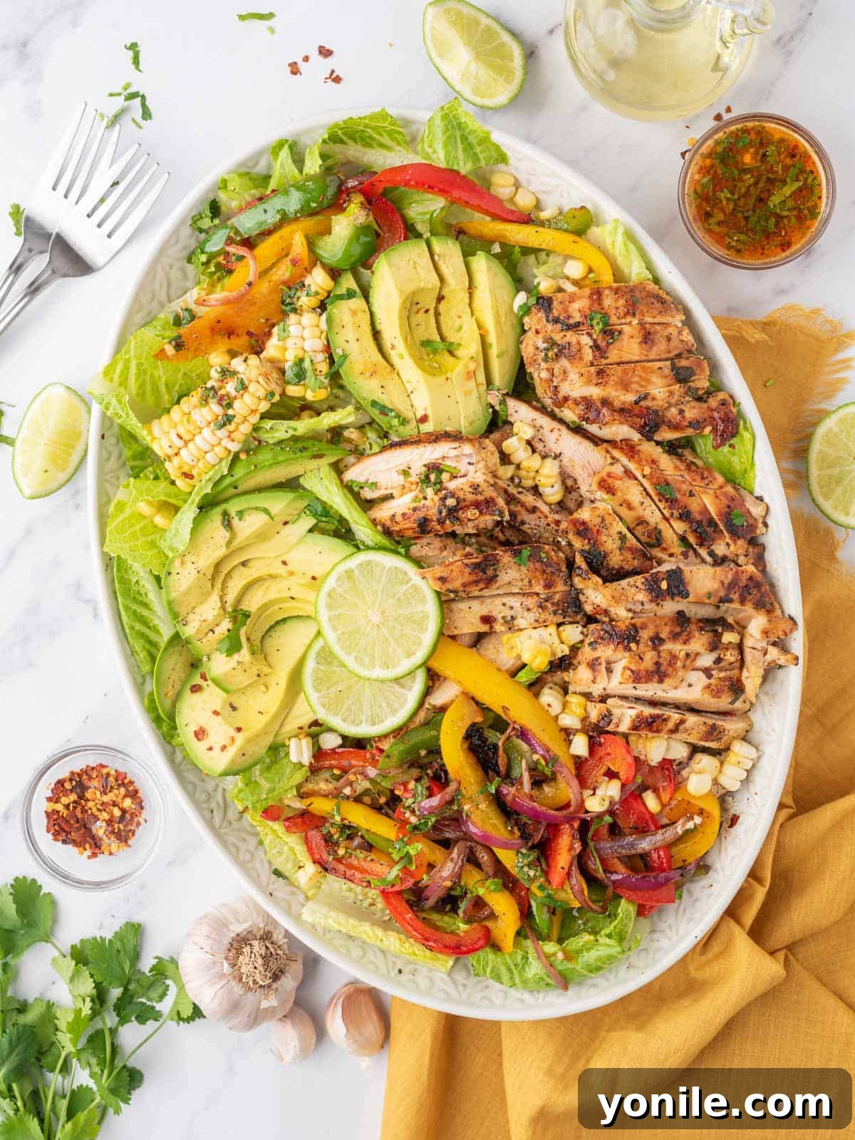 Fiesta chicken salad platter with forks on the side.