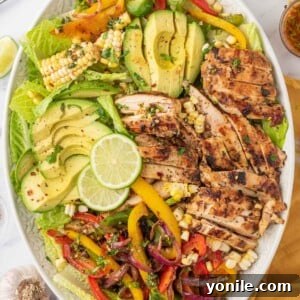 Southwest salad with grilled chicken on a serving platter.