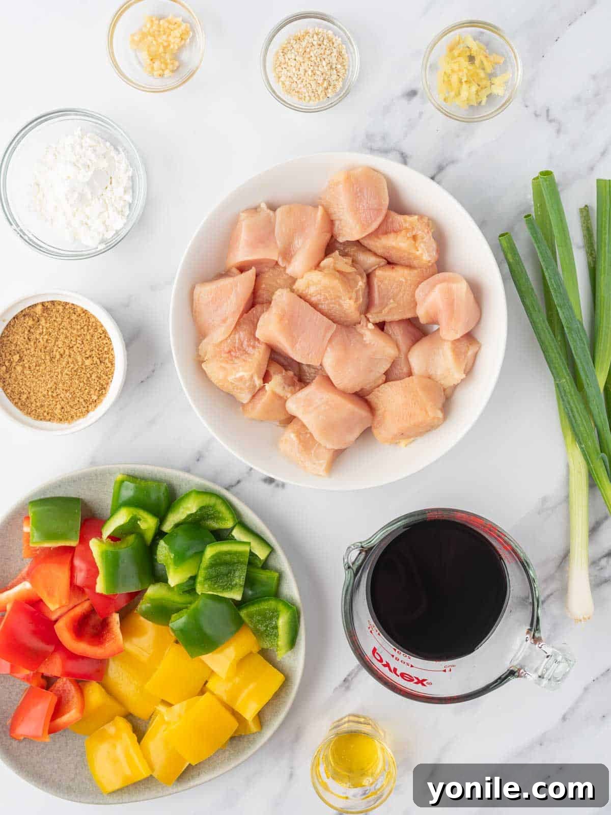 Teriyaki Glazed Chicken Skewers 3 Ingredients for homemade teriyaki sauce and chicken skewers including chicken breast, bell peppers, soy sauce, ginger, garlic, brown sugar, sesame oil, and cornstarch.