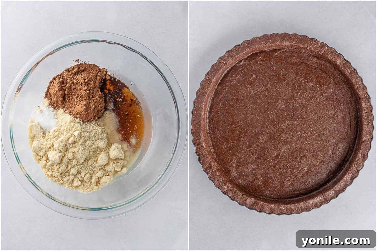 Preparing the no-bake vegan chocolate pie crust in a tart pan, pressing the mixture evenly.