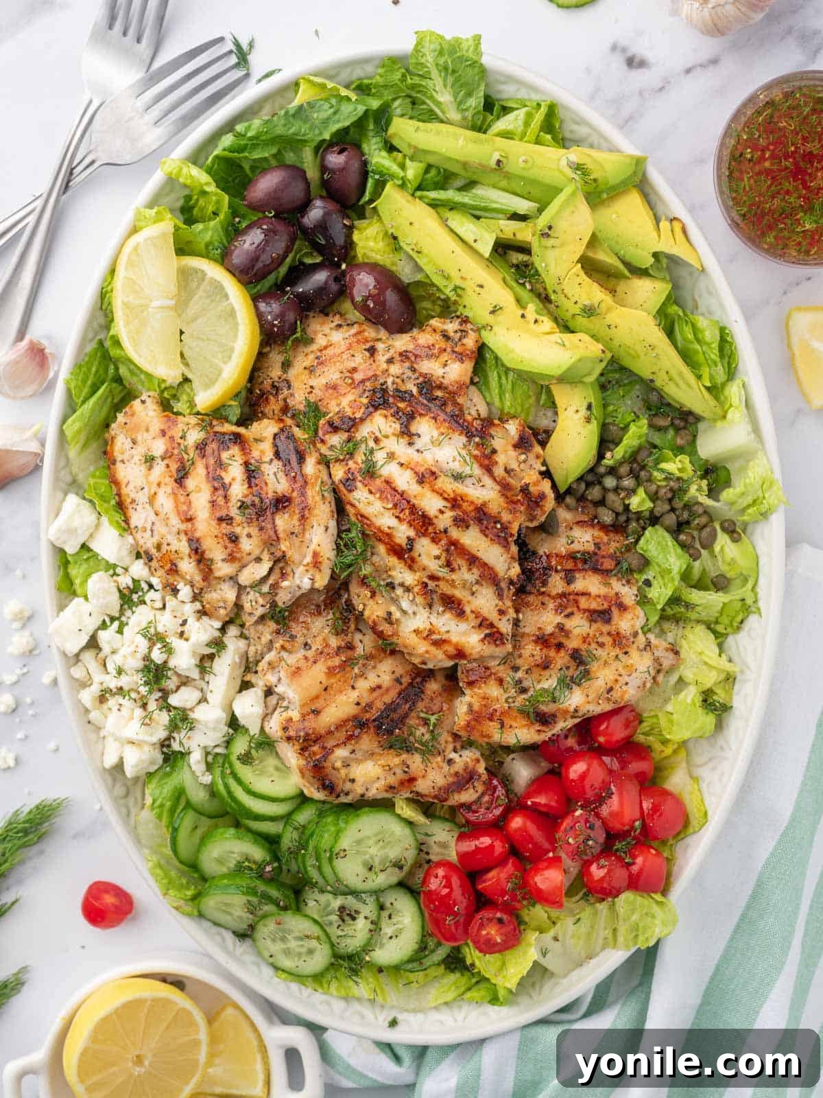 Vibrant Greek Grilled Chicken Salad 7 A large platter with grilled chicken greek salad.