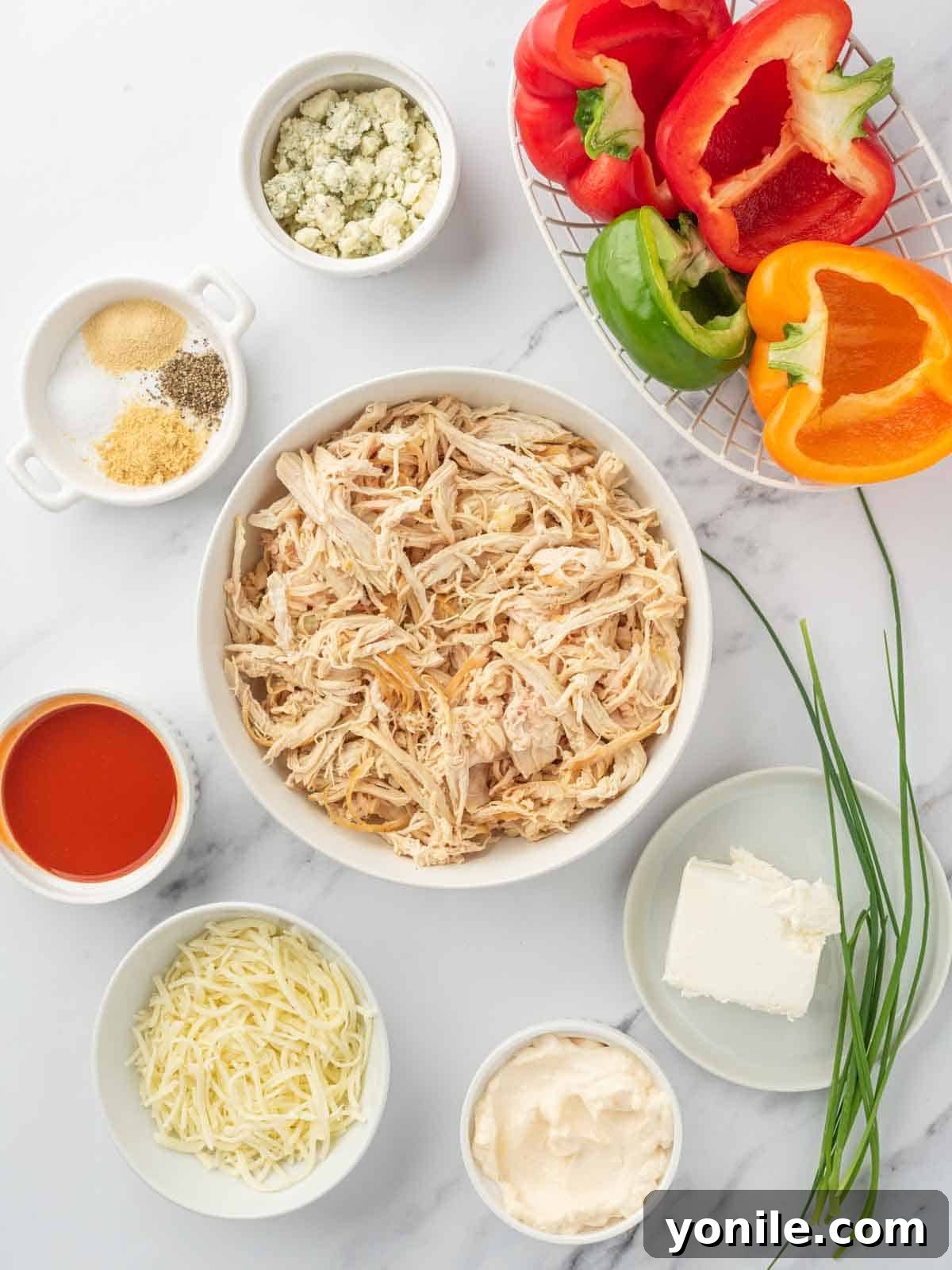 Ingredients needed for buffalo chicken stuffed peppers.