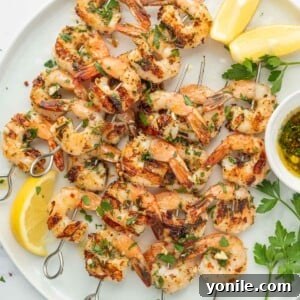 Garlicky Shrimp kabobs on a platter.